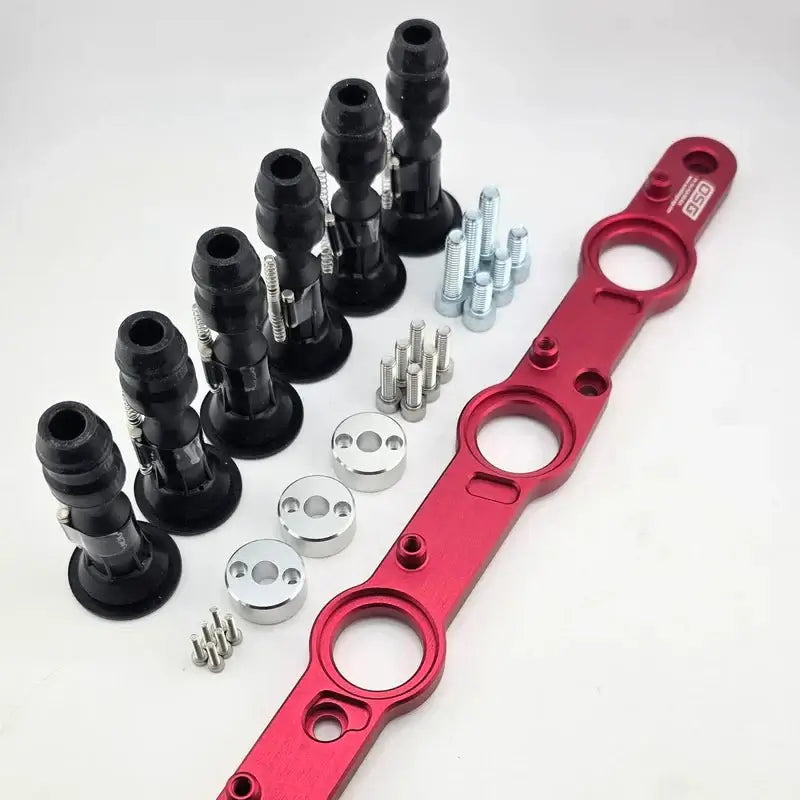 Load image into Gallery viewer, Nissan RB DOHC R35 ignition coil conversion kit featuring a red anodized bracket, black coils, and hardware.

