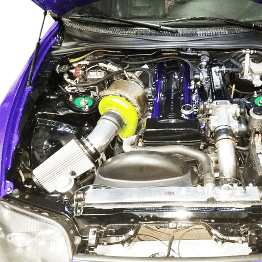 ZSPEC Stage-3 fastener kit installed in a purple Toyota Supra MKIV engine bay with shiny stainless and billet hardware.