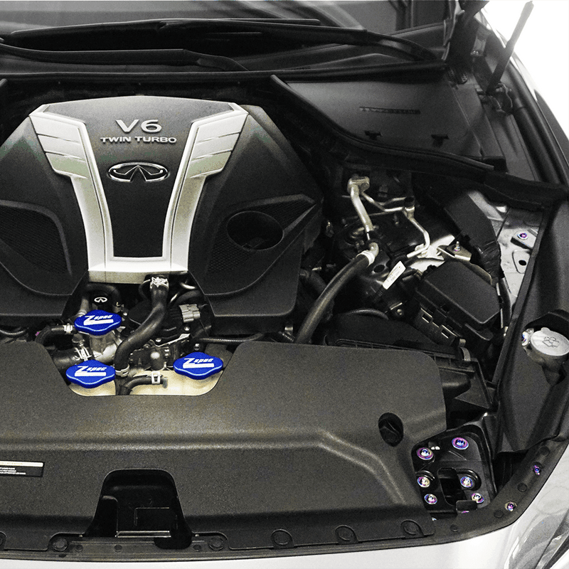 Cargue la imagen en el visor de la galería, ZSPEC titanium dress-up bolt kit installed in an Infiniti Q50/Q60 VR30 engine bay with blue fluid caps.
