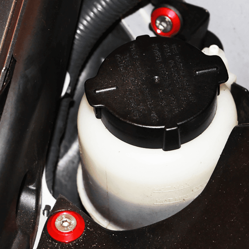 Cargue la imagen en el visor de la galería, ZSPEC fastener kit with red billet aluminum washers installed on a Nissan 370z Z34 engine bay fluid reservoir.
