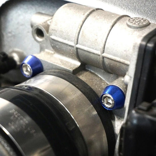 Blue ZSPEC fastener kit installed on a Nissan GTR R35 engine component.