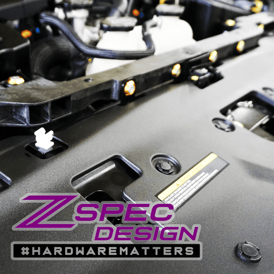 ZSPEC gold hardware bolt kit installed on a Nissan Z RZ34 engine bay engine cover.
