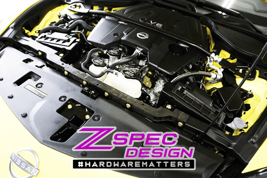 ZSPEC bolt dress-up kit installed on a Nissan Z RZ34 engine bay, featuring gold stainless fasteners.