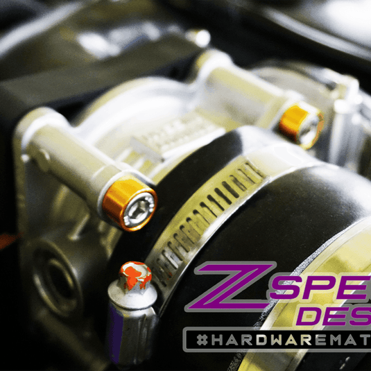 ZSPEC Stage-1 gold billet and stainless steel bolt hardware kit installed on a Nissan Z RZ34 engine.
