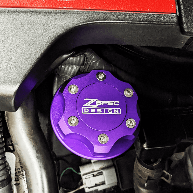 Load image into Gallery viewer, Purple ZSPEC billet oil filler cap with titanium bolts installed on a Nissan/Infiniti/Datsun engine.
