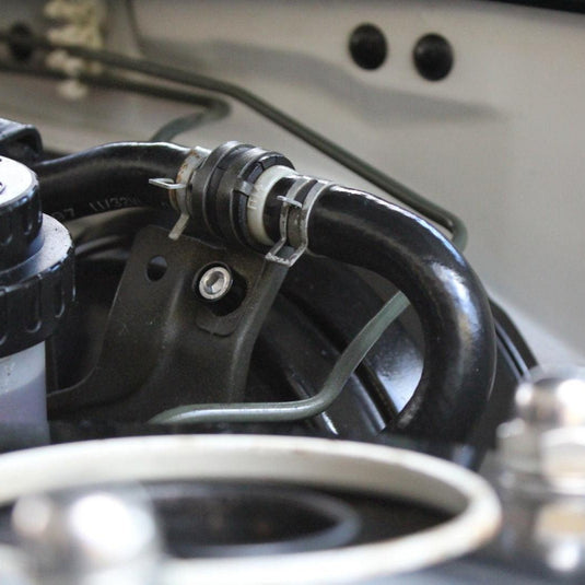 ZSPEC stainless fastener kit installed on a Nissan 240SX S14 engine bay bracket with a black billet finish.