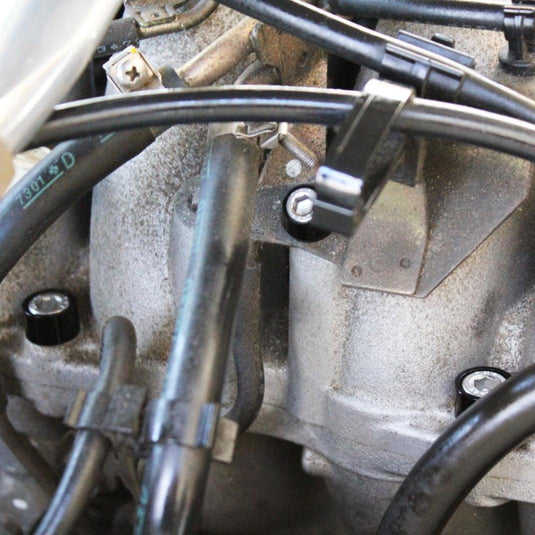 ZSPEC black billet and stainless fastener kit installed on a 95-98 Nissan 240SX S14 engine intake manifold.