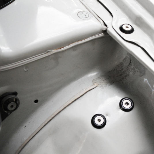 ZSPEC Stage-1 dress-up bolt kit in white Nissan 240SX S14 engine bay featuring black and stainless fasteners.