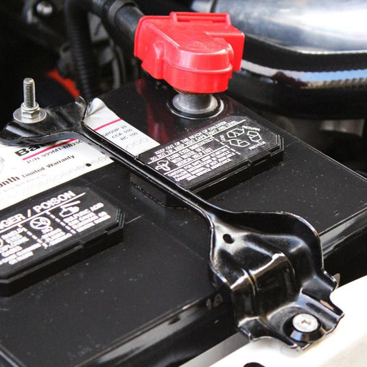 ZSPEC stainless fastener kit for S14 240SX battery tie-down, showing silver bolt on black bracket.