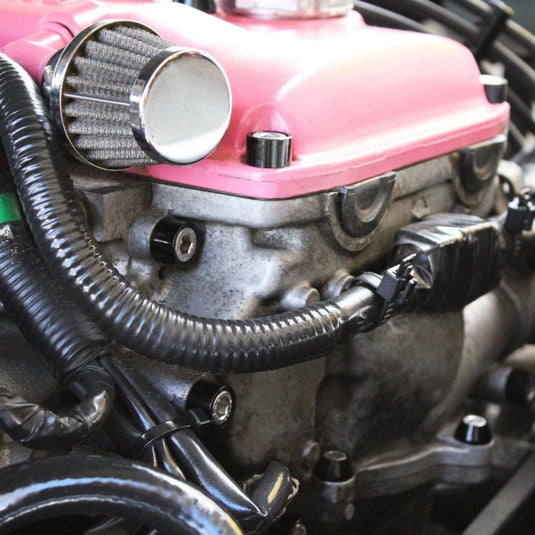 ZSPEC bolt kit on a Nissan 240SX S14 engine. Features black billet washers and stainless bolts on a pink valve cover.