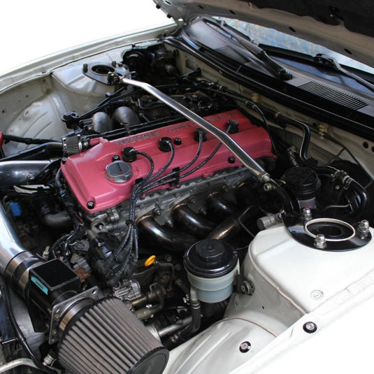 ZSPEC stainless fastener kit installed on a pink Nissan 240SX S14 engine bay.
