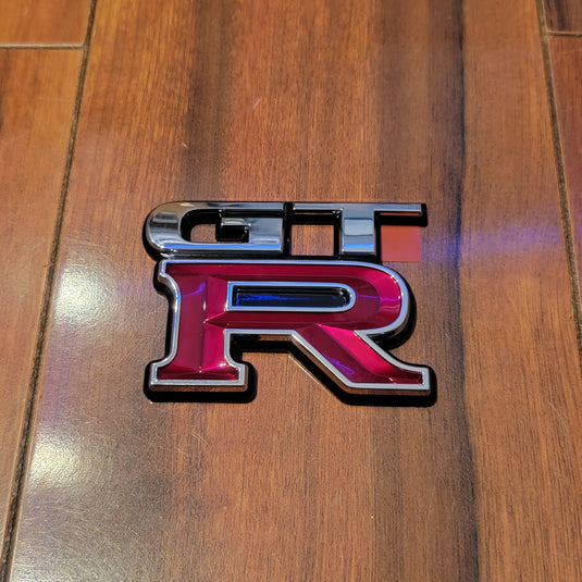 Nissan R34 Skyline GT-R Trunk Rear Emblem - NizmoPartsPlug