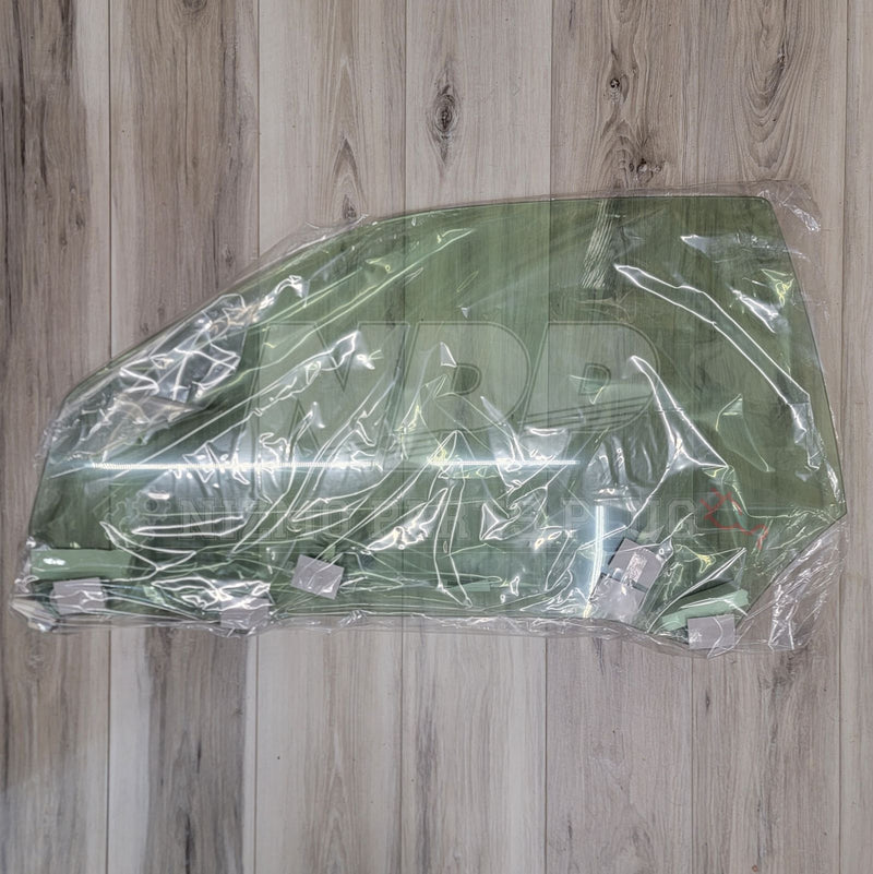 Load image into Gallery viewer, Nissan R34 Skyline Coupe Front Door Glass Assembly LH - NizmoPartsPlug

