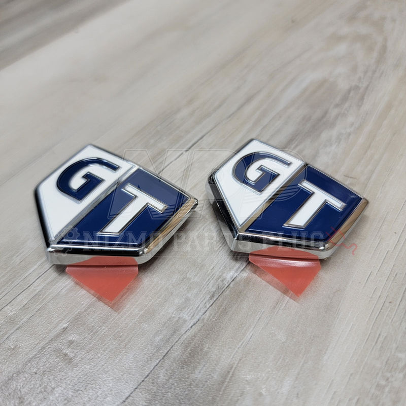 Load image into Gallery viewer, Nissan R34 Skyline GT Front Fender Emblem Set - NizmoPartsPlug
