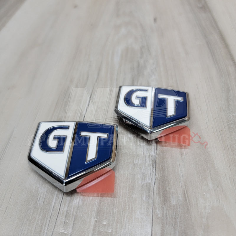 Load image into Gallery viewer, Nissan R34 Skyline GT Front Fender Emblem Set - NizmoPartsPlug
