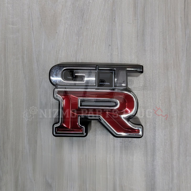 Load image into Gallery viewer, Nissan R34 Skyline GTR Front Grill Emblem - NizmoPartsPlug
