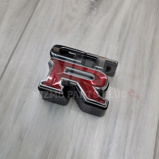 Nissan R34 Skyline GTR Front Grill Emblem - NizmoPartsPlug