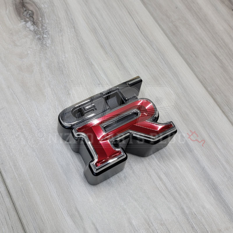 Load image into Gallery viewer, Nissan R34 Skyline GTR Front Grill Emblem - NizmoPartsPlug
