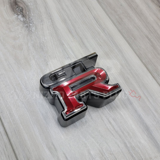 Nissan R34 Skyline GTR Front Grill Emblem - NizmoPartsPlug