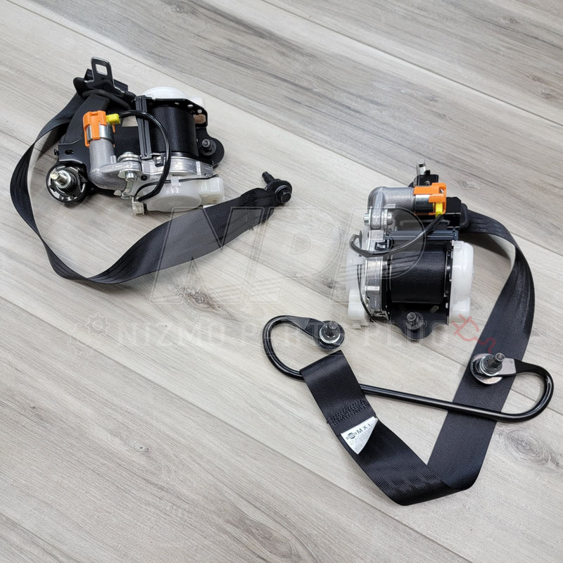 Load image into Gallery viewer, Nissan R34 Skyline GTR Front Seat Belt Retractor Pre-Tensioner Set - NizmoPartsPlug
