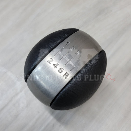 Nissan R34 Skyline GT-R Series 2 leather and brushed metal 6-speed shift knob.