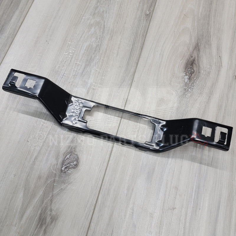 Load image into Gallery viewer, Black metal license plate lamp bracket for Nissan Skyline R34, showing clean, pre-owned condition.
