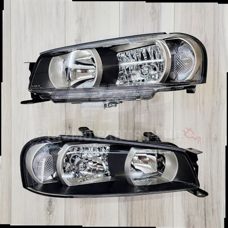 Load image into Gallery viewer, Nissan R34 Skyline GTT/GT-R H.I.D. Headlight Set Complete - NizmoPartsPlug
