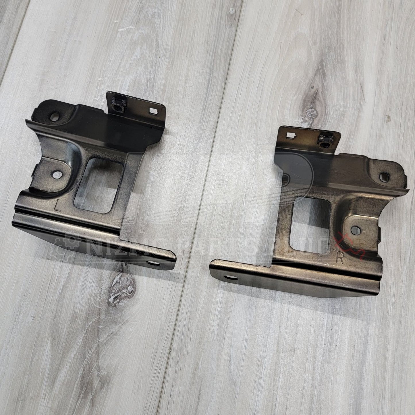 Nissan R34 Skyline GTR Headlight Bracket Set
