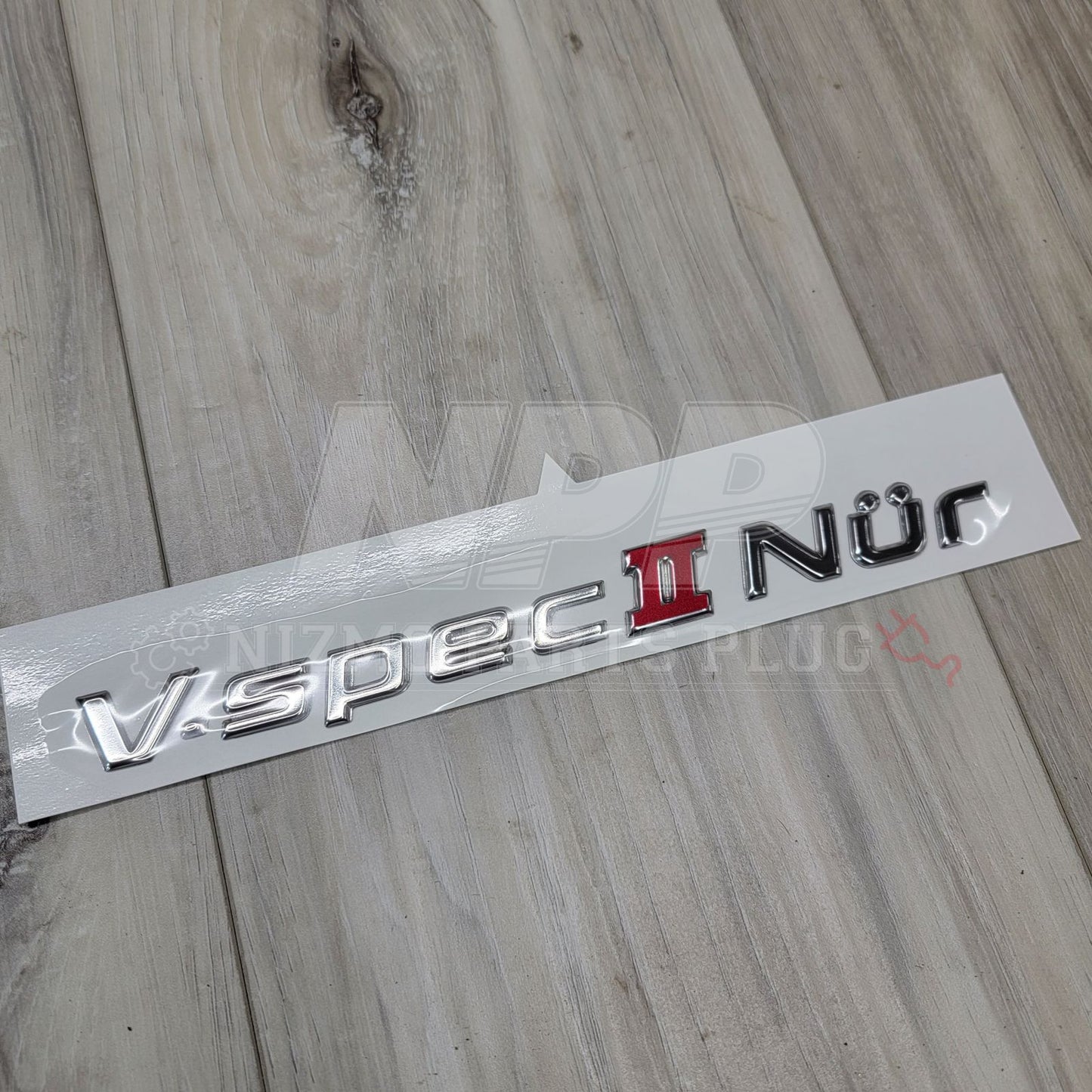Emblema del maletero del Nissan R34 Skyline GT-R Vspec II