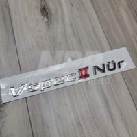 Emblema del maletero del Nissan R34 Skyline GT-R Vspec II