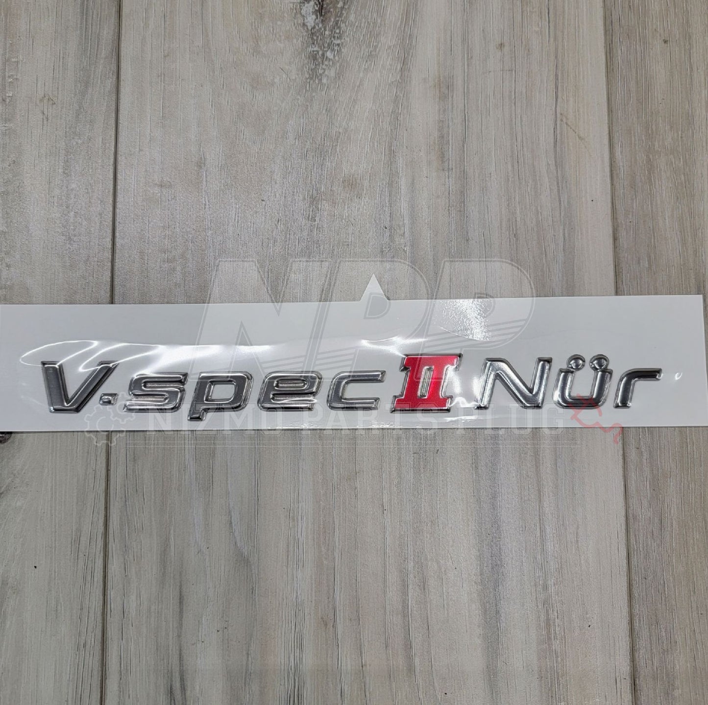 Emblema del maletero del Nissan R34 Skyline GT-R Vspec II