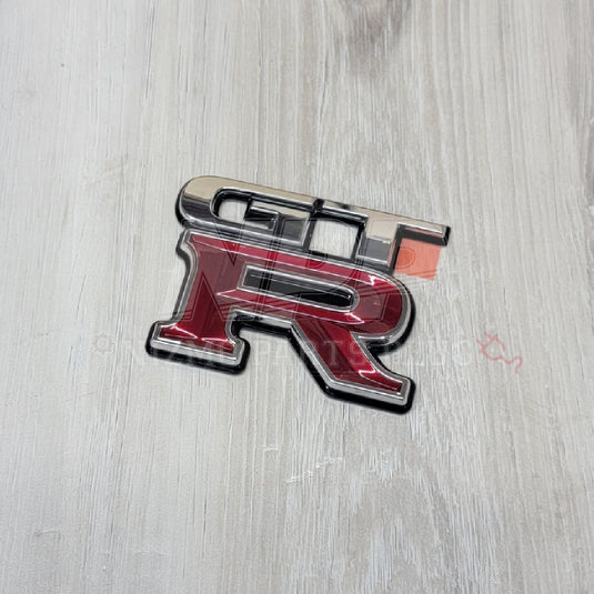 Nissan R34 Skyline GT-R Trunk Rear Emblem - NizmoPartsPlug